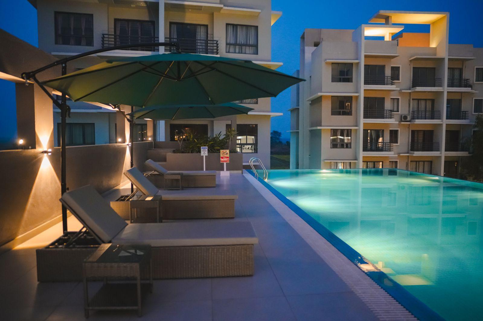 The Pearl Club Resort rooftop infinity pool and gardens in Santiniketan